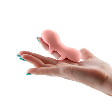 Peach-coloured silicone vibrator with two rings to secure around finger Nudie Co