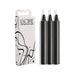 Pack of three black candles and white cardboard packaging Nudie Co