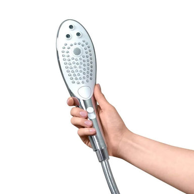 Hand holding a shower head with multiple settings for clitoral stimulation Nudie Co