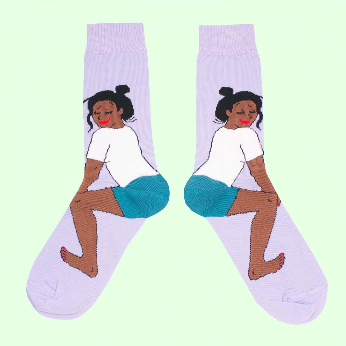 Purple socks printed with a woman twerking in shorts and a white T shirt Nudie Co