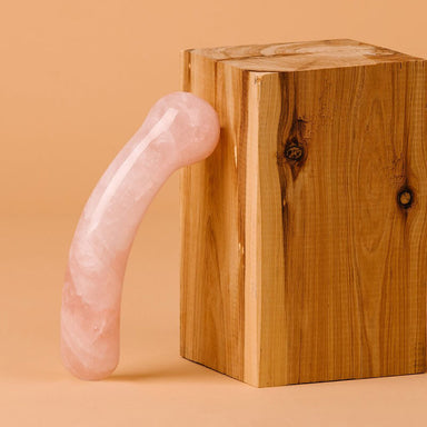 La Loba large pink crystal dildo made out of rose quartz with one rounded end for G Spot stimulation Nudie Co