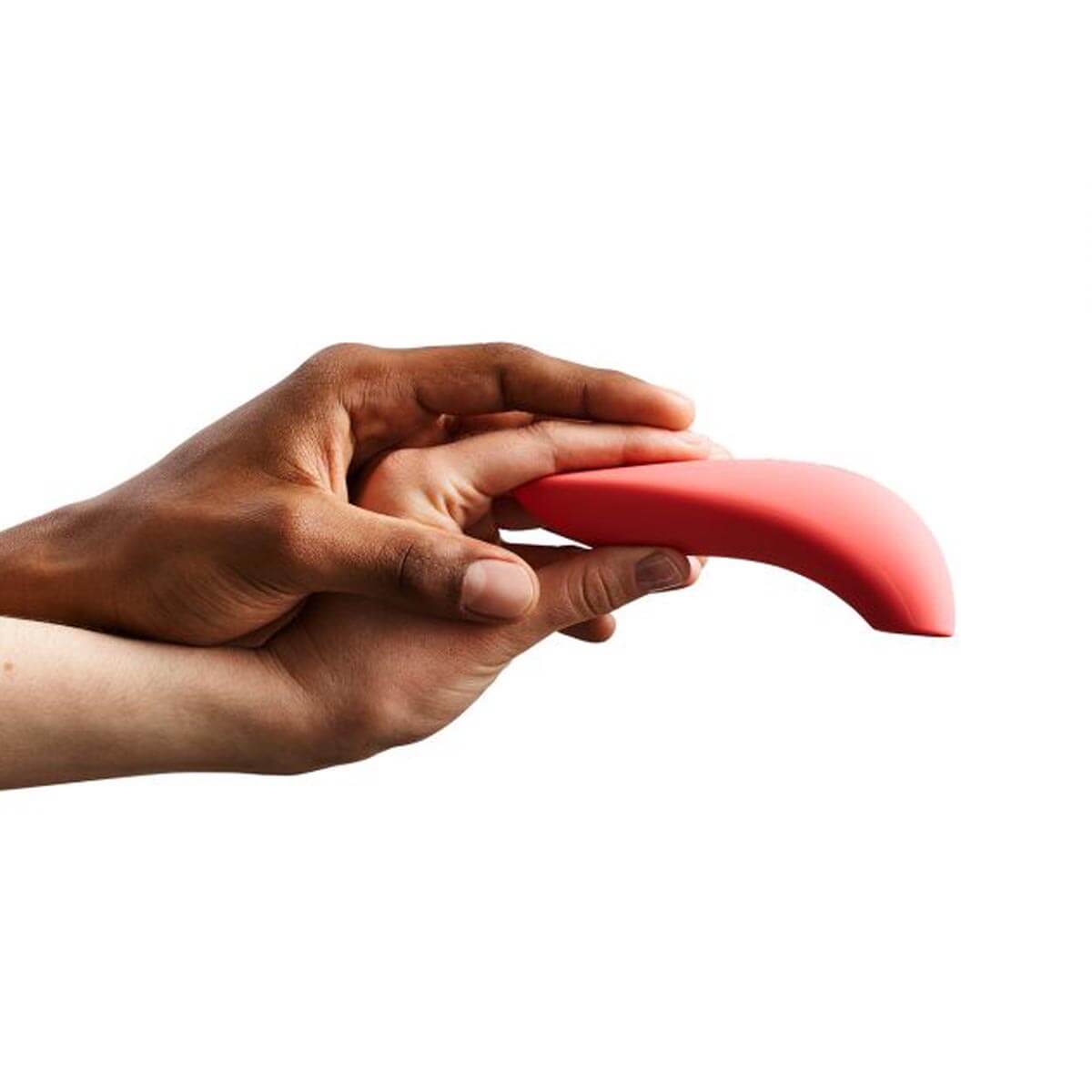 Two people's hands holding an orange silicone air pressure clitoral stimulator with round opening Nudie Co