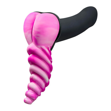 Side view of pink silicone dildo base stimulating cushion with ribbed shaft placed on flat side of black dildo Nudie Co