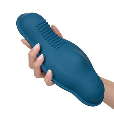 Hand holding Blue silicone grinding pad with two buttons and small bumps for extra sensations Nudie Co