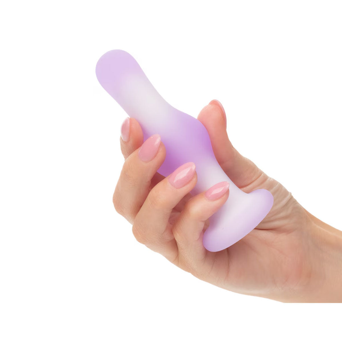 Hand holding a purple and white silicone butt plug against a white background Nudie Co