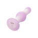 Purple and white silicone butt plug on a white background with charging pins at bottom Nudie Co