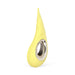 Yellow teardrop-shaped silicone clitoral vibrator with a metallic ring on a white background Nudie Co