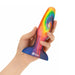 Hand holding a colourful tie-tye silicone butt plug on a white background Nudie Co