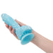 Hand holding a blue and white marble dildo with suction cup Nudie Co