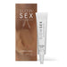 White tube of vegan clitoral balm for warming sensations and its packaging Nudie Co