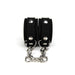 Side view of black silicone cuffs with silver metal details and chain Nudie Co