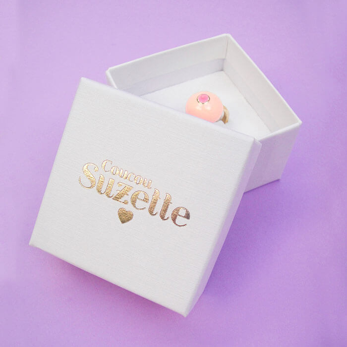 Coucou Suzette branded box with pink boob ring inside Nudie Co