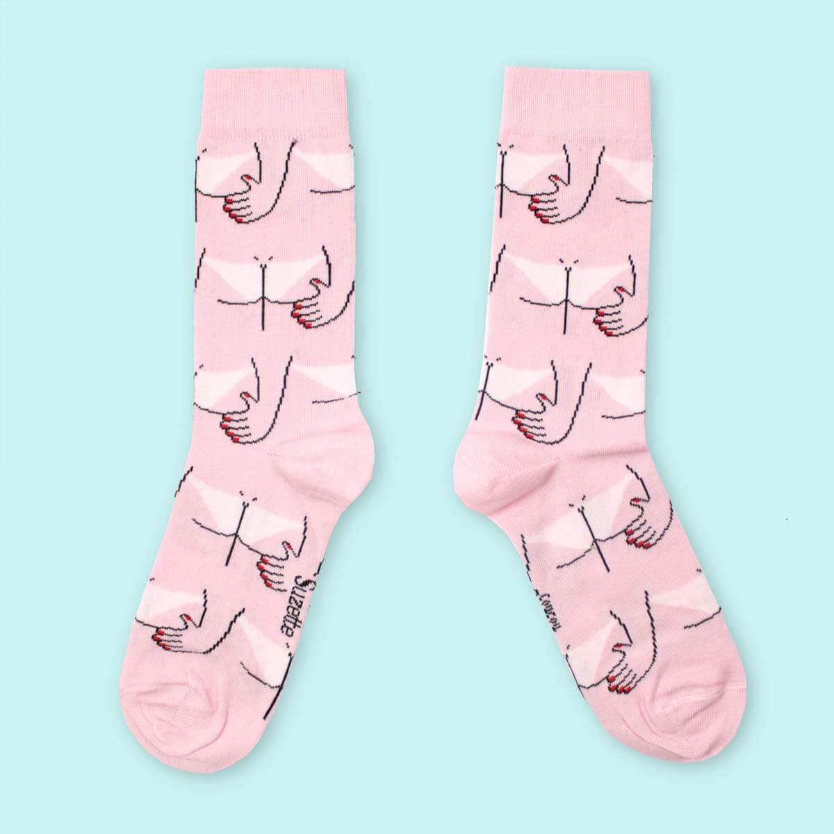 Pink cotton socks with hand on buttocks details over blue background Nudie Co