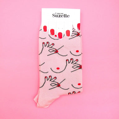 Packaged folded pink socks with boob and nipple print Nudie Co