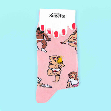 Packaged folded pink socks printed with women having their periods Nudie Co