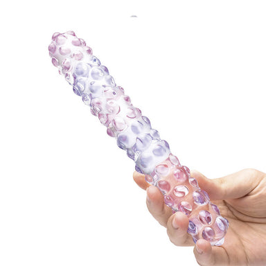 Hand holding a 9 inches glass dildo with bumpy texture on the surface Nudie Co
