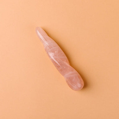La Loba small pink crystal dildo made out of rose quartz with twisted appearance Nudie Co