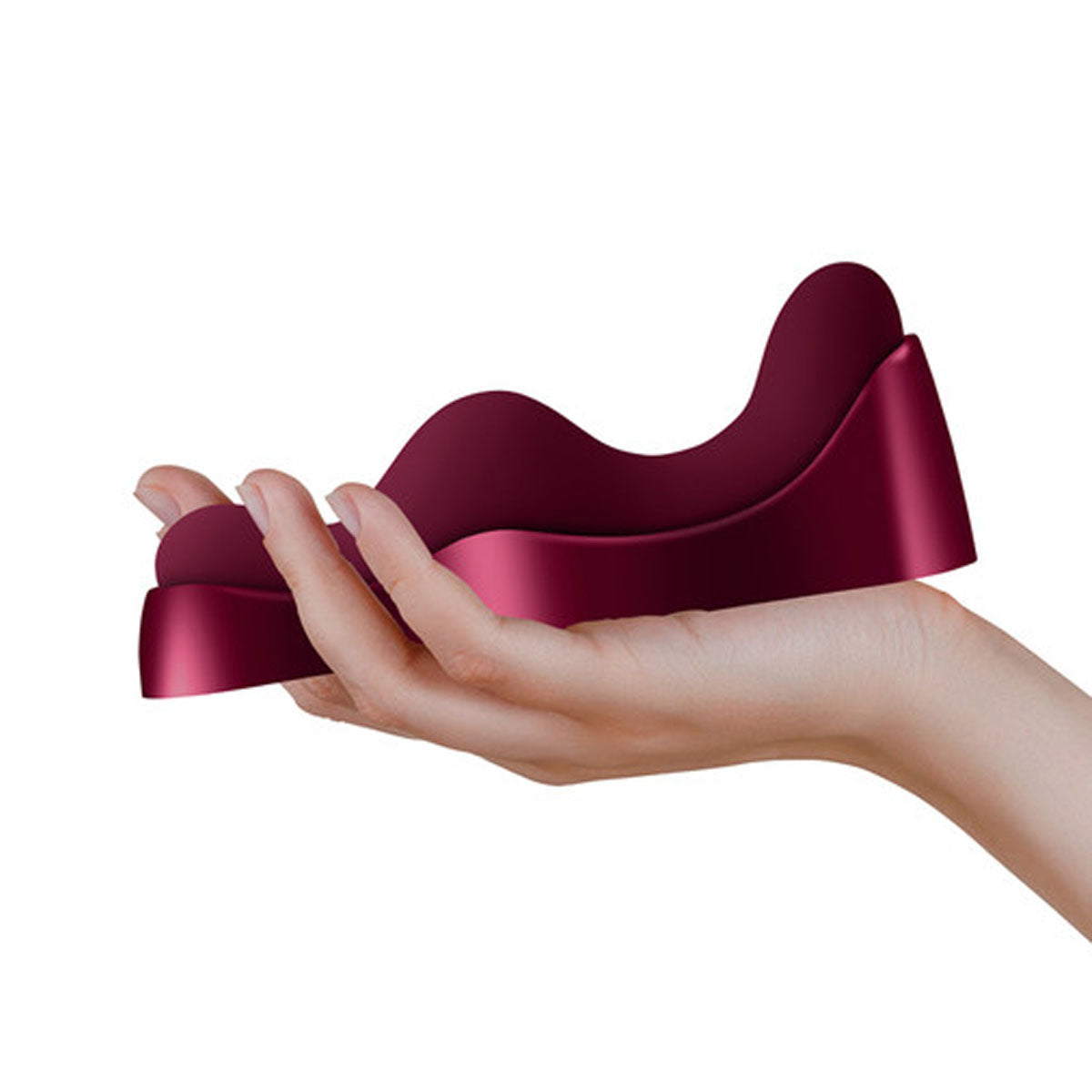 Hand holding a burgundy wavy silicone vibrator on its charging dock Nudie Co