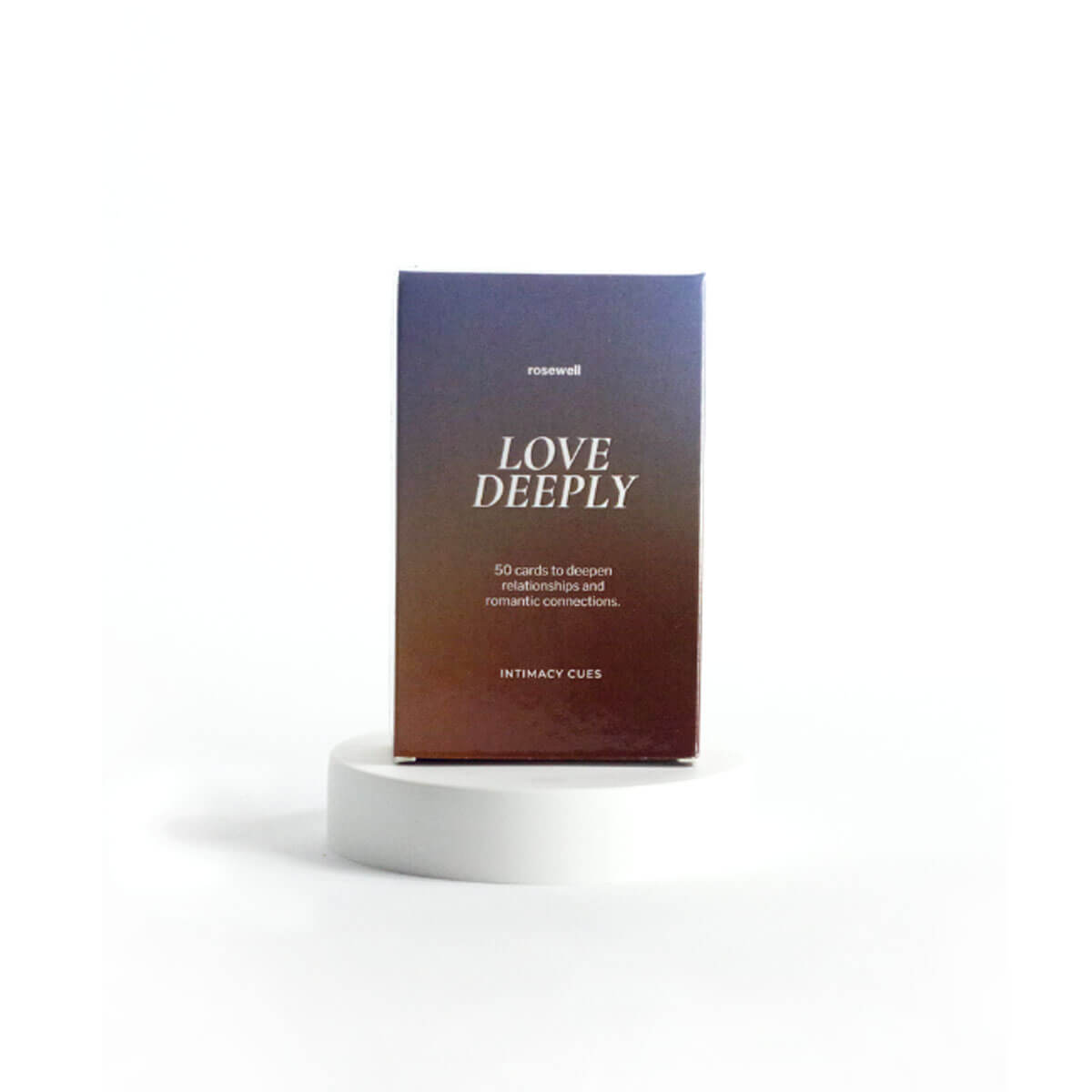 Deck of Rosewell Love Deeply cards on white stand with a blue and brown packaging Nudie Co