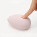 Woman's finger pushing on a soft squishy pink Sakura clitoral vibrator by Tenga Iroha Nudie Co