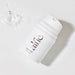 Uncapped bottle Alfie Love Gel over a white background with a water droplets falling on the side Nudie Co