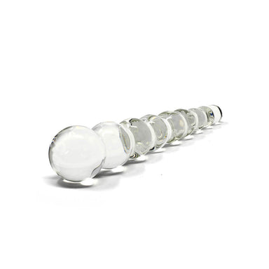 Side view of a hand-blown glass beaded dildo over a white background Nudie Co